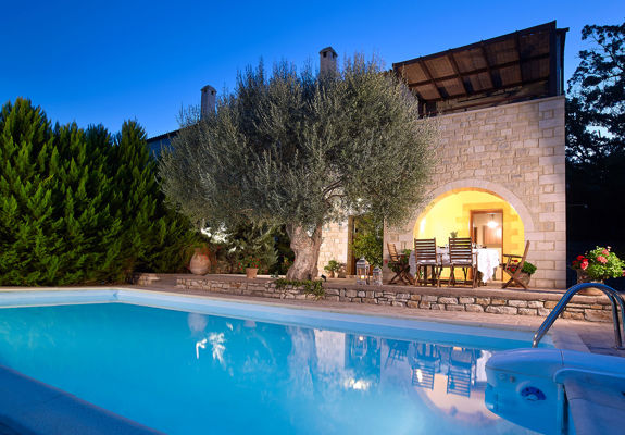 Vederi Estate Villa Kalypso pool, villa exterior and the olive tree at dusk