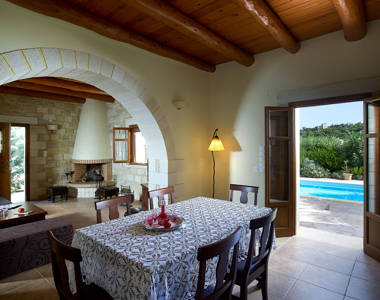 Vederi Estate Villa Kyveli decorated kitchen table and view to the living room