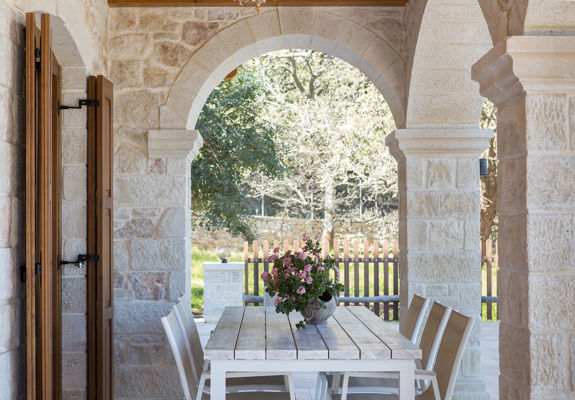 Vederi Estate Villa Melpomeni outdoor decorated wooden table and chairs