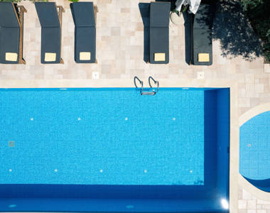 Vederi Estate Villa Melpomeni pool and sunbeds top-down view