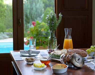 Vederi Estate Villa Alkioni kitchen table full with breakfast