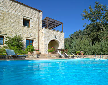 Vederi Estate Villa Alkioni view of the villa exterior and the sunbeds from the pool