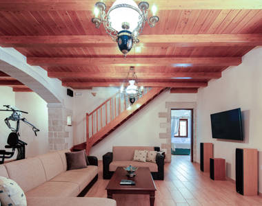 Vederi Estate Villa Melpomeni living room and staircase to the second floor